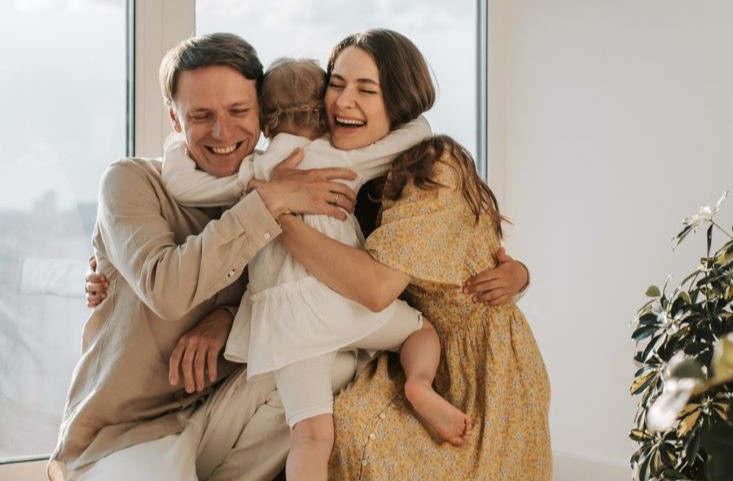 pexels-vlada-karpovich-4609046g_sm Parents hugging their child